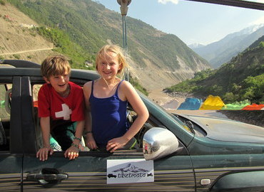 Kids in a jeep, Tibet. Kids in a jeep, Tibet.