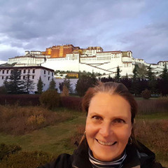 Stefanie Trippler stands in front of the Potala Palance Stefanie Trippler stands in front of the Potala Palance