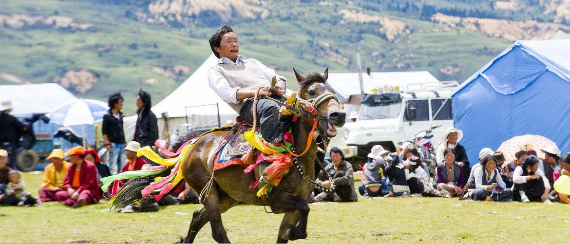 A Tibetan is taking part in the Horse Racing. A Tibetan is taking part in the Horse Racing.