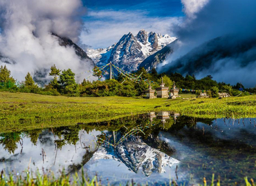 See snow-covered mountain and crystal-alike lake at Gyirong Valley.